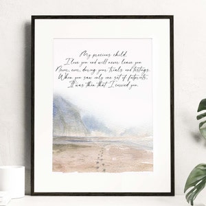 May include: A watercolor painting of a beach with footprints in the sand. The text reads: "My precious child. I love you and will never leave you. Never, ever, during your trials and testings. When you saw only me set of footprints. It was then that I carried you."