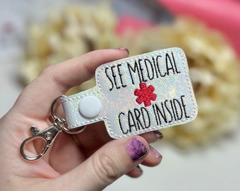 See medical card inside medical awareness Keychain Snap Tab