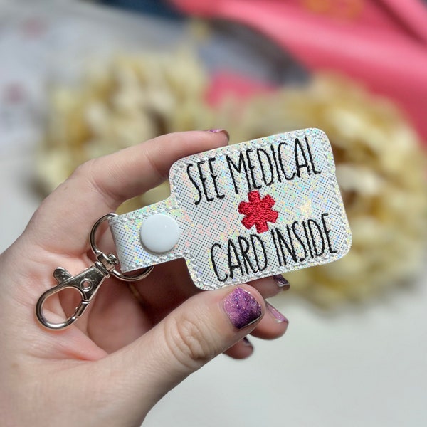 See medical card inside medical awareness Keychain Snap Tab