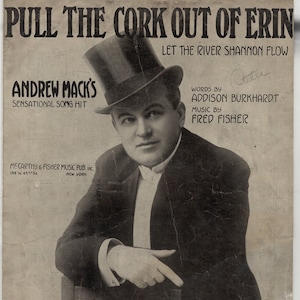 May include: Vintage sheet music cover for "Pull the Cork Out of Erin" featuring Andrew Mack. The black and white image shows a man in a top hat and suit. Text includes song title, artist, and publisher information.