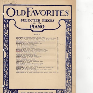 May include: Sheet music titled "Old Favorites Selected Pieces for the Piano" with a blue decorative border. The cover lists musical pieces by various composers, including Sarasate and Schulhoff. Published by Carl Fischer, Inc., Cooper Square, New York.