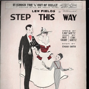 May include: A vintage sheet music cover for the song "Step This Way" by Lew Fields. The cover features a black and white illustration of three people dancing. The text "If I Knock the "L" Out of Kelly (It Would Still Be Kelly to Me)" is at the top of the cover.