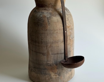 Primitive Wooden Vessel with Ladel