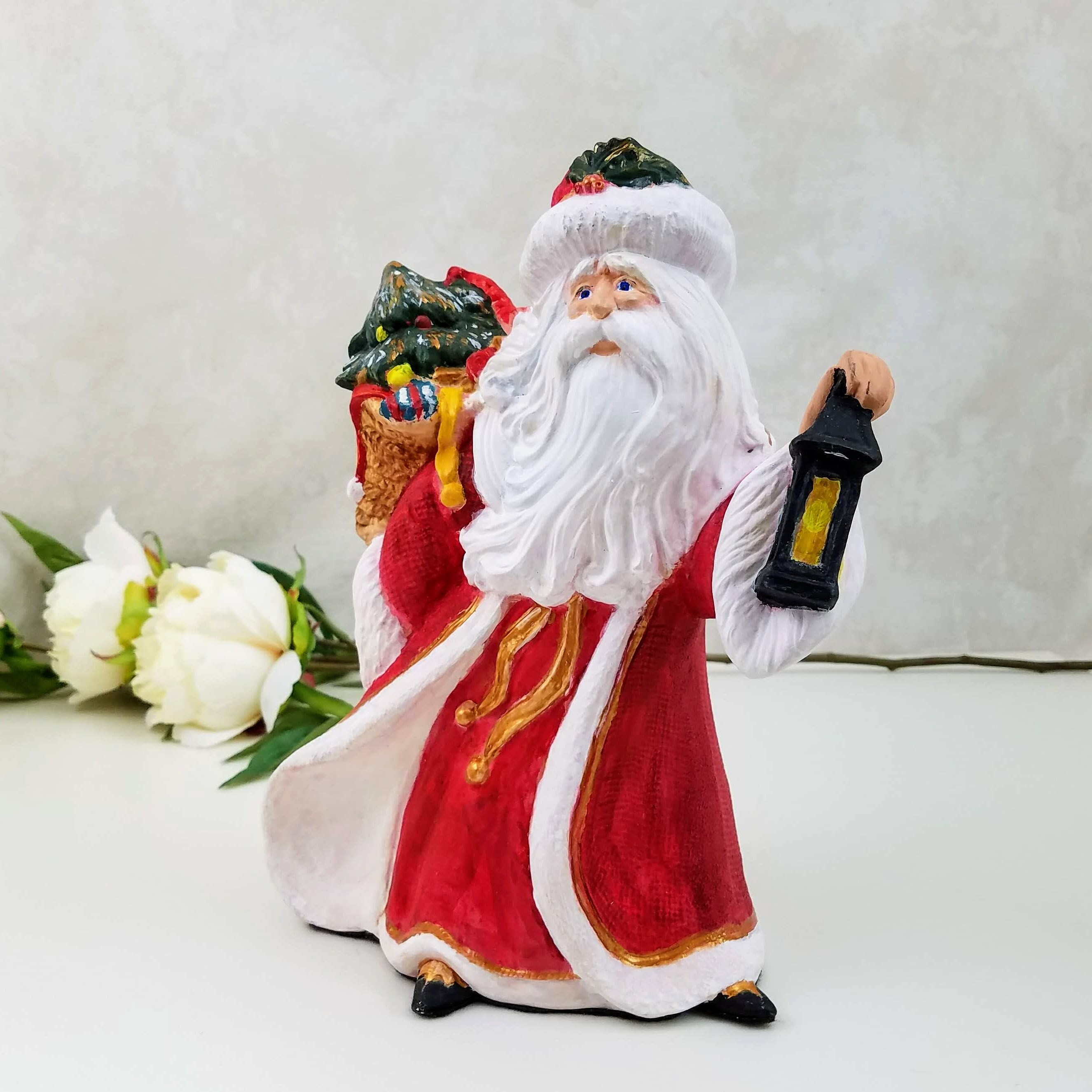 santa figurines from different countries