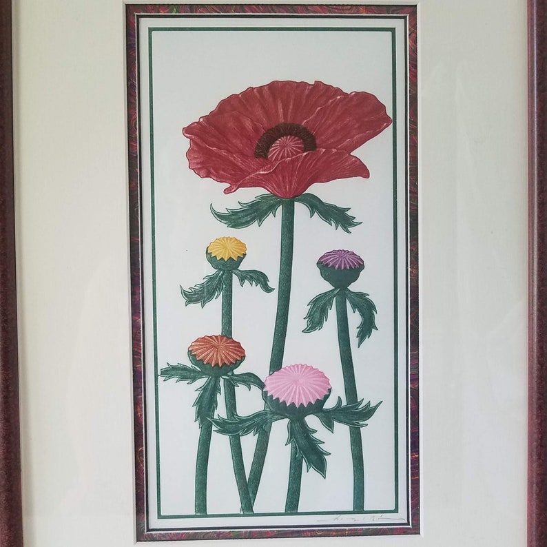 May include: A framed print of a red poppy flower with five buds in various colors, including yellow, orange, pink, and purple. The print is set against a white background.