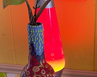 Painted upcycled wine bottle vase