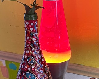 Painted upcycled wine bottle vase