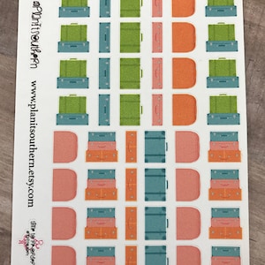 May include: A sheet of stickers featuring various luggage designs. The stickers are in shades of green, blue, orange, and pink. The stickers are arranged in rows and columns on a white background. The text "Plan It Southern" and "www.planitsouthern.etsy.com" is printed on the sheet.