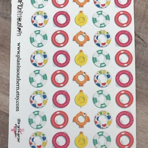May include: A sheet of colorful stickers featuring various summer-themed designs. The stickers include images of inflatable rings, ducks, and turtles. The sheet is white with a blue and white border. The text "Plan It Southern" and "www.planitsouthern.etsy.com" is printed on the sheet.