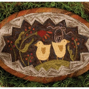 May include: A brown oval-shaped rug with a white border and a design of two yellow birds in a green bush with red berries. The rug is surrounded by green moss.