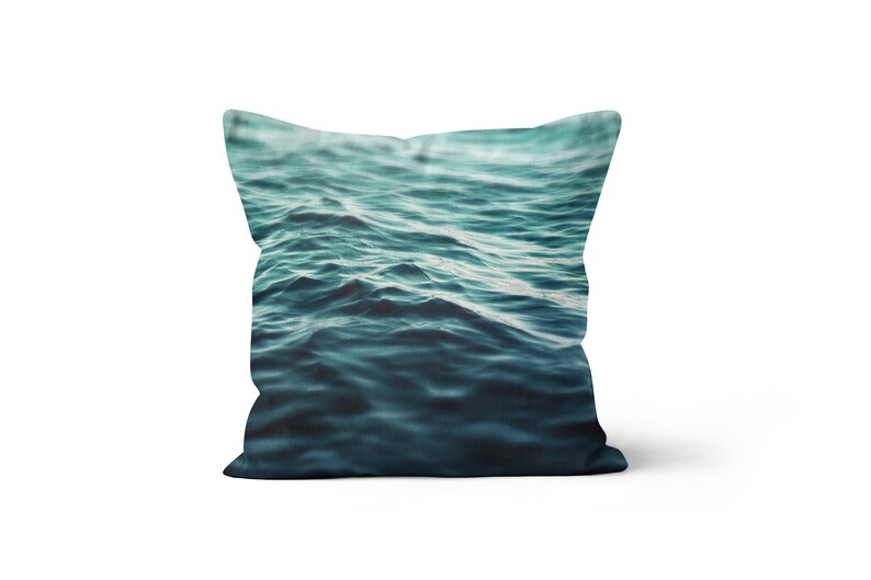 A vibrant coastal accent for your beach style interior settings, our square accent throw pillow features a blue green ocean water design on both sides! Available in several different pillow sizes to choose from.