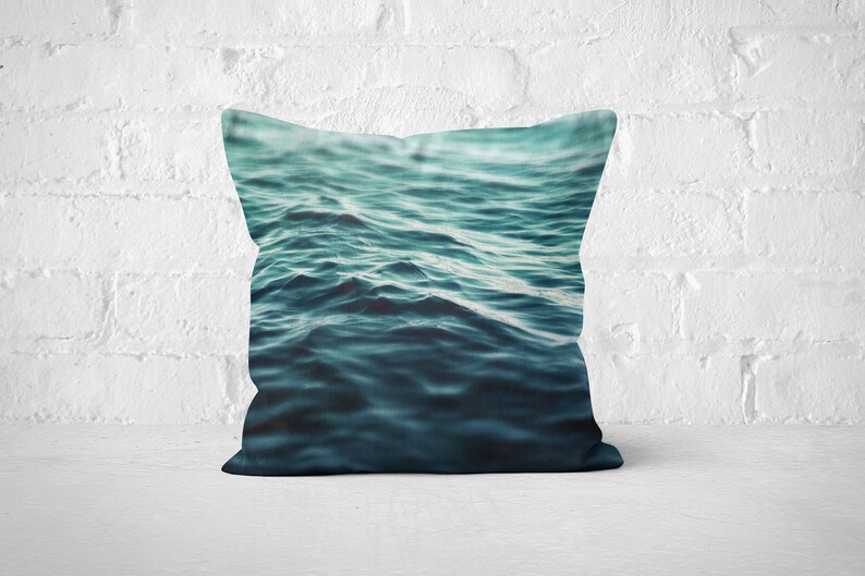 A vibrant coastal accent for your beach style interior settings, our square accent throw pillow features a blue green ocean water design on both sides! Available in several different pillow sizes to choose from.