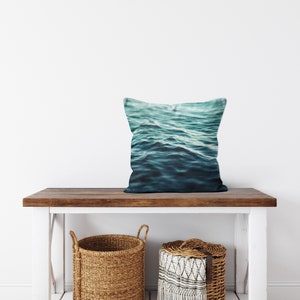 A vibrant coastal accent for your beach style interior settings, our square accent throw pillow features a blue green ocean water design on both sides! Available in several different pillow sizes to choose from.