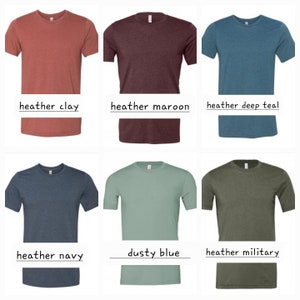 May include: Six different colored t-shirts, all with a crew neck and short sleeves. The colors are heather clay, heather maroon, heather deep teal, heather navy, dusty blue, and heather military.
