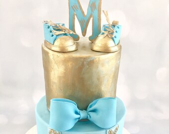 Gumpaste baby shoe and bow tie  Baby shoe cake topper  Cake topper  Baby Shower topper Fondant Shoes Gumpaste shoe topper Gumpaste Bowtie