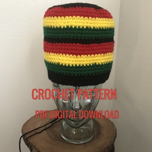 May include: A crochet pattern for a black, red, yellow, and green beanie. The pattern is available as a digital download. CROCHET PATTERN PDF DIGITAL DOWNLOAD