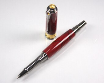May include: A red and silver retractable pen with a gold-toned top. The pen has a marbled design and a silver tip.