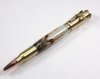May include: A brass and copper bullet pen with a wood-like pattern in brown, white and black.