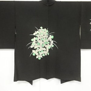 A Vintage Japanese Kimono Haori 100% silk black with light green and white blossoms lined in ochre satin