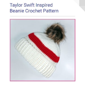 Op de afbeelding: Witte gehaakte beanie met een rode streep en een bruine nep bont pompon. Taylor Swift geïnspireerd beanie haakpatroon.