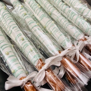 Chocolate Dipped Pretzel Sticks. Chocolate Color can be customized. Ribbon is not included. Request Ribbon before ordering.