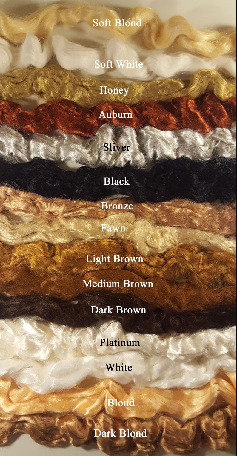 K&ouml;nnte beinhalten: Eine Farbpalette von Haarfasern in verschiedenen Farbt&ouml;nen, darunter Soft Blond, Soft White, Honey, Auburn, Sliver, Black, Bronze, Fawn, Light Brown, Medium Brown, Dark Brown, Platinum, White, Blond und Dark Blond. Die Farbbezeichnungen sind sichtbar.