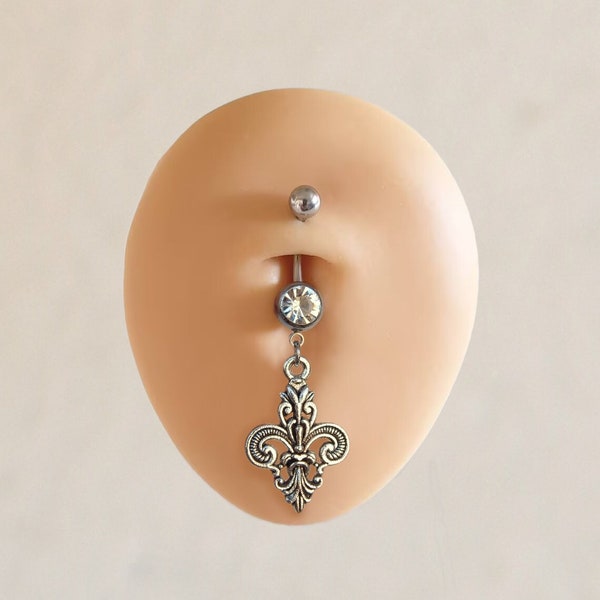 Piercing bauchnabel en acier chirurgical « Fleur-de-Lis » dans le ton argenté. Couleurs cristallines au choix: noir, blanc, rouge, bleu, vert, orange, rose