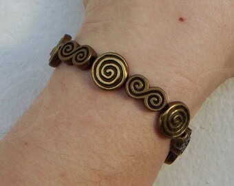 Swirls beaded elastic bracelet "Madre" in bronze tone