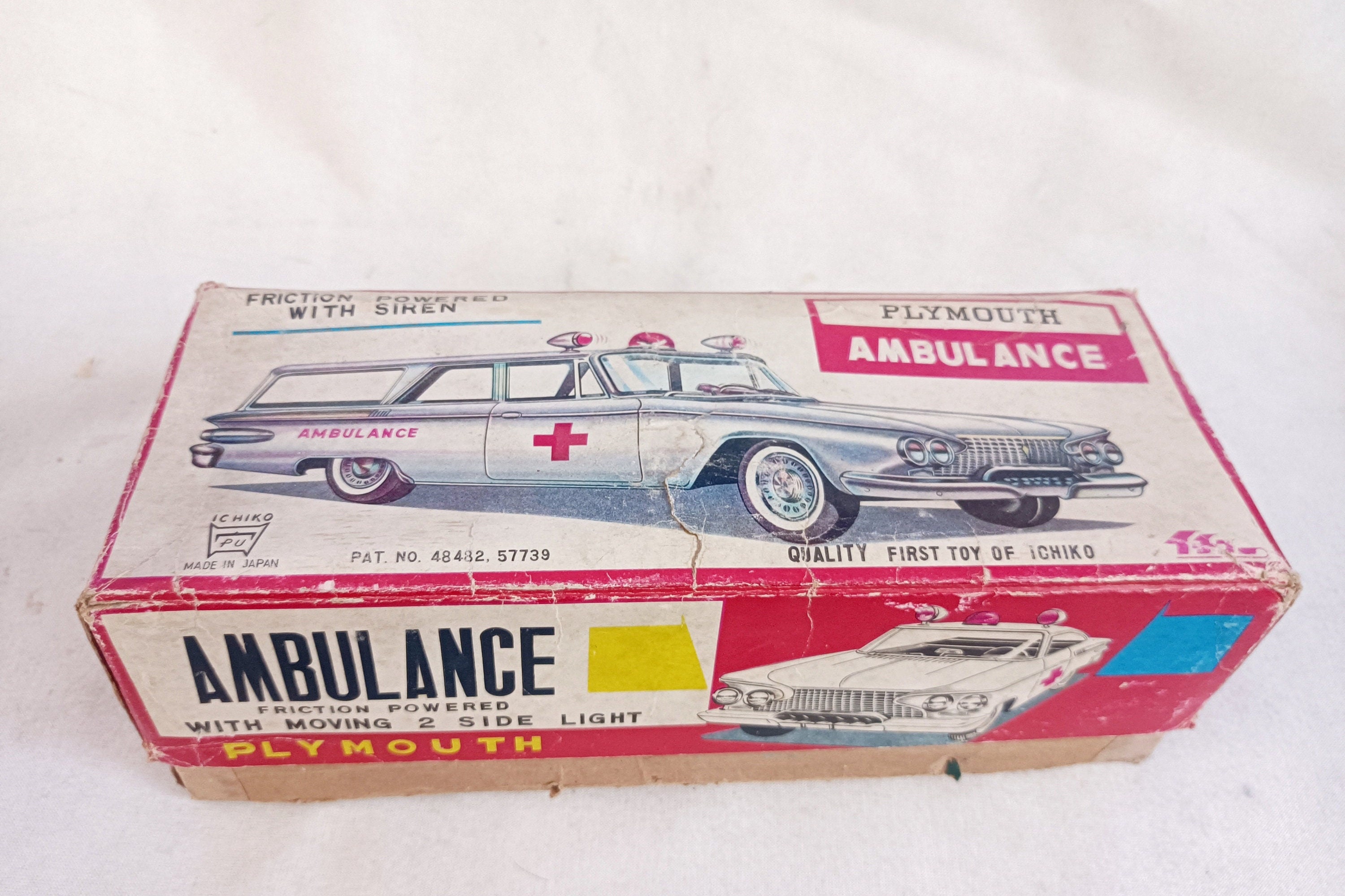 Vintage Ichiko Japan Tin Toy: 1961 Plymouth Ambulance Station