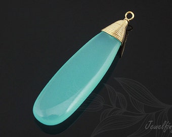 May include: A light blue teardrop-shaped pendant with a gold wire wrapped around the top. The pendant is made of chalcedony and has a smooth, polished finish.