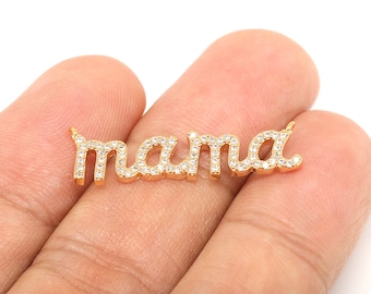May include: Gold-tone "mama" charm with clear cubic zirconia stones.