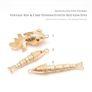 May include: Gold-plated vintage koi and carp pendants with red gem eyes. The image shows three articulated fish charms, perfect for DIY jewelry. The text on the image reads: "ARTICULATED FISH CHARMS, VINTAGE KOI & CARP PENDANTS WITH RED GEM EYES, GOLD PLATED FINDINGS - DIY JEWELRY SUPPLIES."