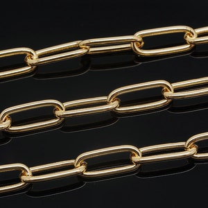 May include: A gold chain necklace with oval-shaped links. The chain is made of a thick, durable metal and has a polished finish.