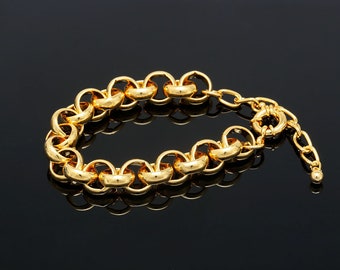 May include: A gold chain bracelet with a chunky link design. The bracelet has a lobster clasp closure.
