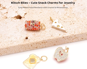 May include: Gold-plated food pendants with enamel and rhinestones. The image shows a roll, a slice of cheese, a piece of toast with butter, and a half apple. The text reads "Kitsch Bites - Cute Snack Charms for Jewelry."