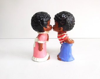 Oh so cute dolls of a girl and a boy kissing each other, made of ceramic in the 70s.