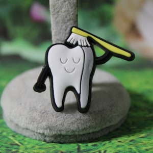 Tooth with brush shoe charm