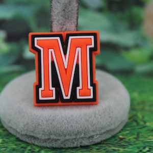 Orange letter M shoe charm