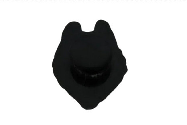 May include: A solid black enamel pin shaped like a wolf head silhouette. The design features a stylized, pointed ear profile and a rounded snout area, rendered in a flat, matte black finish with clean, defined edges throughout the entire shape.