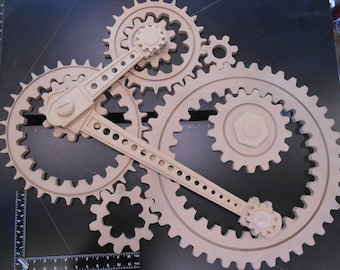 Wooden Gear Sculpture in Progress: 9 large wood gears; 2 coupling rods; 6 small accessories