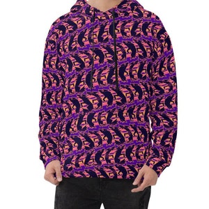 May include: A purple hoodie with a repeating pattern of pink and orange abstract shapes. The hoodie has a drawstring hood and a kangaroo pocket.