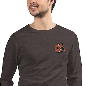 May include: A dark heather grey long-sleeved t-shirt with an embroidered image of two foxes cuddling. The foxes are orange and white.