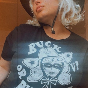 buck up or Buck Off vintage 80s tshirt, gender neutral 1980s, cowgirl, cowboy, line dancing, hand made and Screenprinted, tassels, western