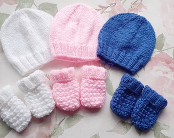 Hand knitted newborn baby hat and mittens set, baby wear, baby clothing, white, pink and blue.