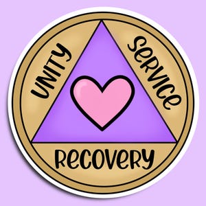 May include: A round sticker with a gold border and a white outline. The sticker features a purple triangle with a pink heart in the center. The words "UNITY", "SERVICE", and "RECOVERY" are written in black around the triangle.