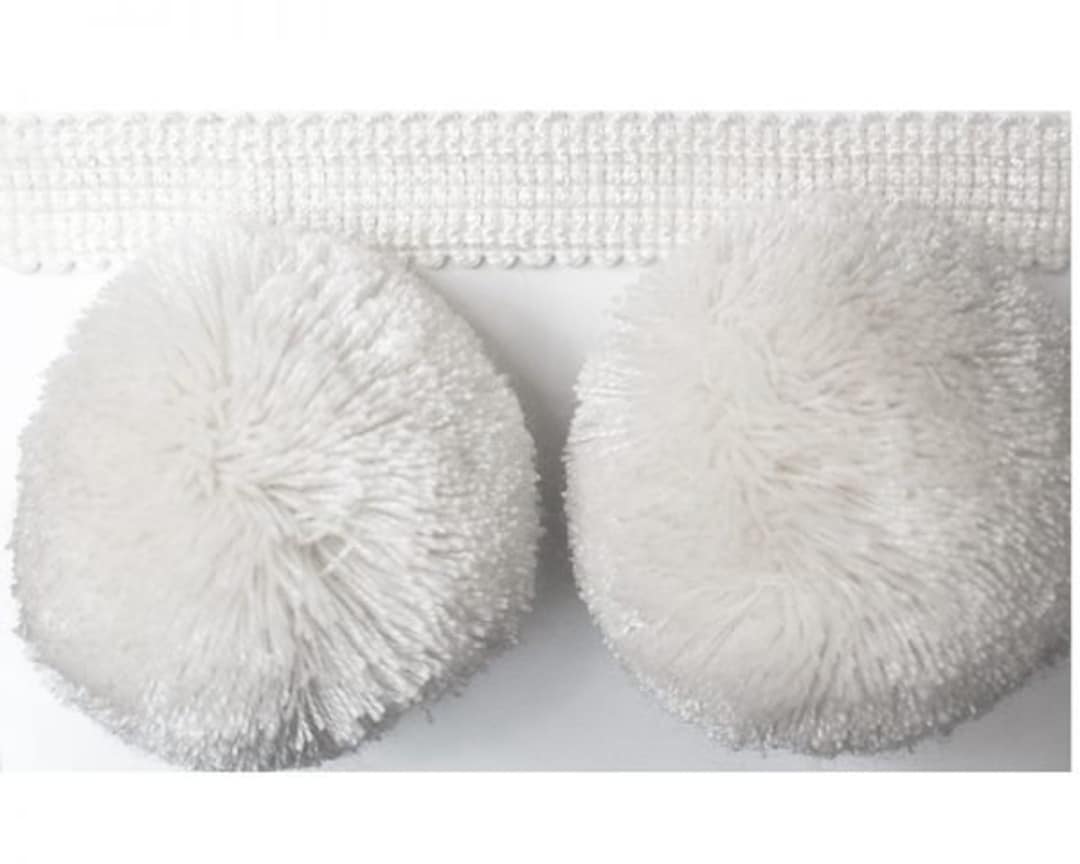 white fluffy pom pom