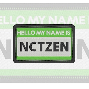 May include: A rectangular embroidered patch featuring a bright green border and background. The text HELLO MY NAME IS is stitched in white at the top, while the word NCTZEN is embroidered in bold black letters on a white rectangular center panel.