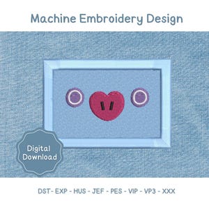 May include: A machine embroidery design featuring a light blue rectangular frame containing two purple circular eyes and a central pink heart with two black vertical lines. The text reads Machine Embroidery Design and Digital Download.