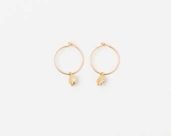 A pair of Hoops Gold Plated Disc Earrings with a tiny bee Seahorse Starfish or shell pendant