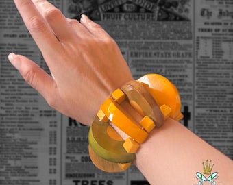 Pulsera elástica gruesa con forma de rebanada de fruta de baquelita de los años 40